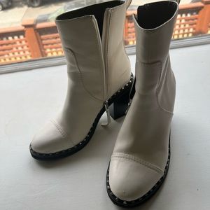 White boots with silver spikes